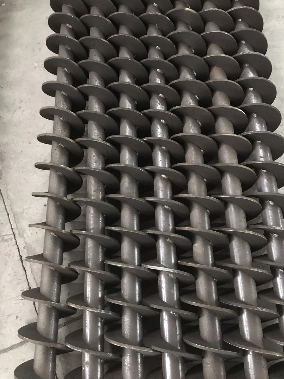 Multiple shafted auger screw assemblies for a production order