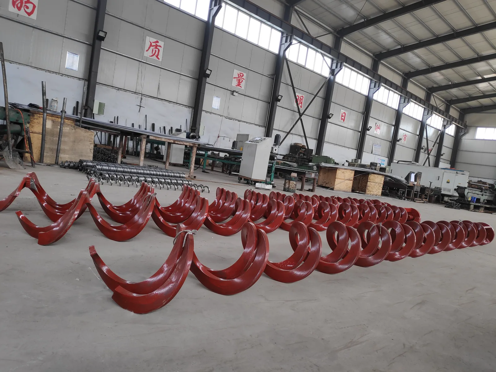 Open-centre shaftless auger flight assemblies in the workshop