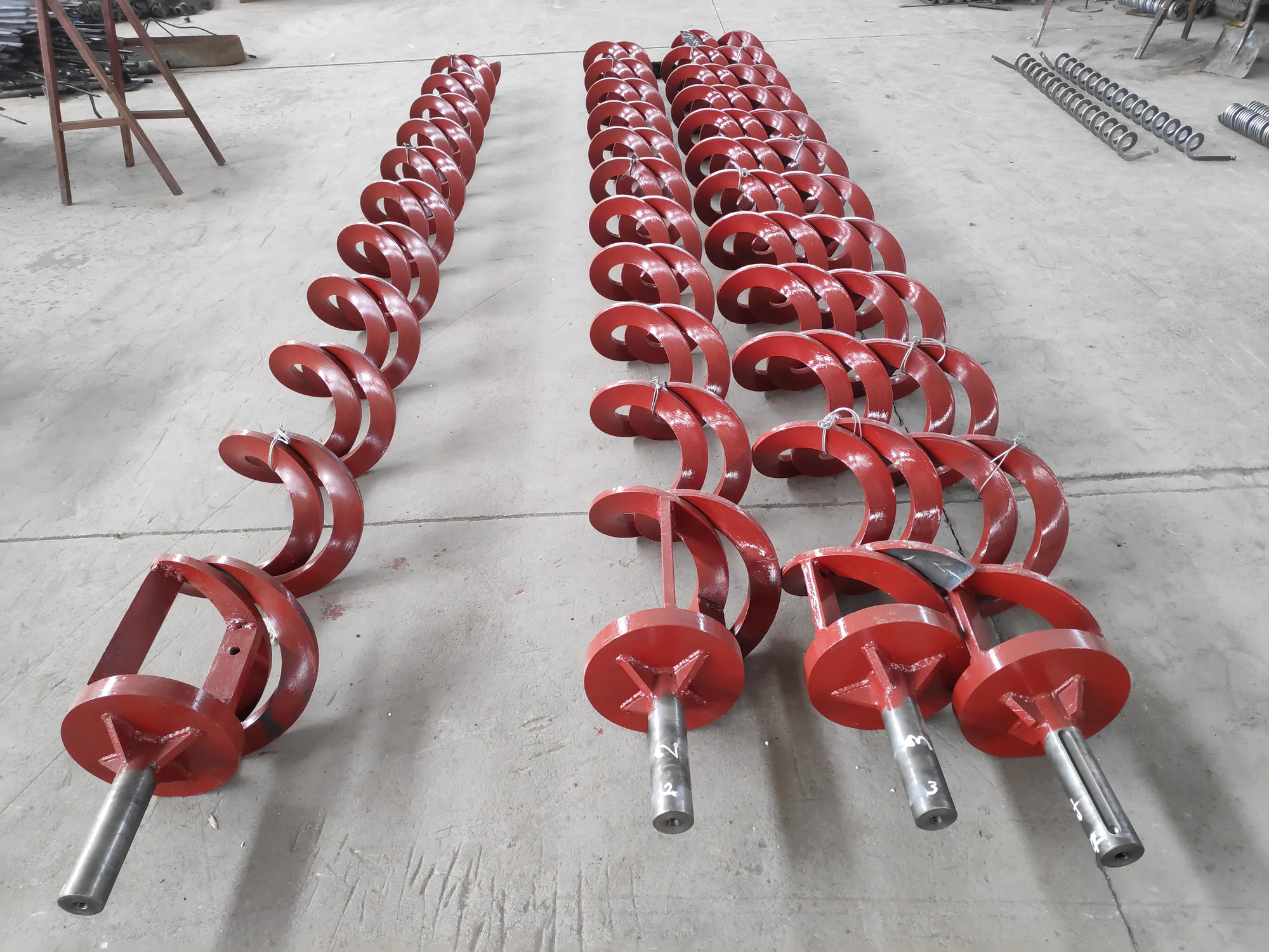 Custom auger screw assemblies with welded helical flights for drilling applications Custom auger screw assemblies with welded helical flights for drilling applications