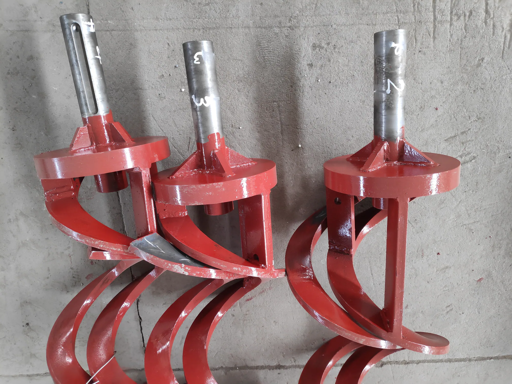 Custom fabricated auger screws with precision formed spiral flights for soil drilling Custom fabricated auger screws with precision formed spiral flights for soil drilling